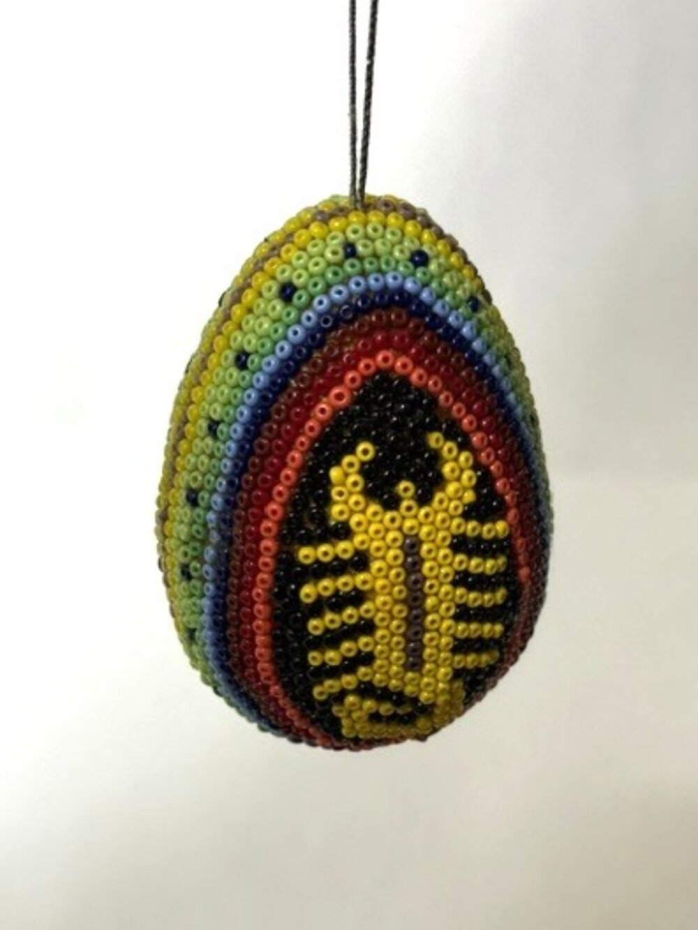 Vintage handmade Huichol beaded egg Christmas ornament.